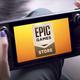 Someone holding a Steam Deck with Epic Games Store's logo displayed on the screen.